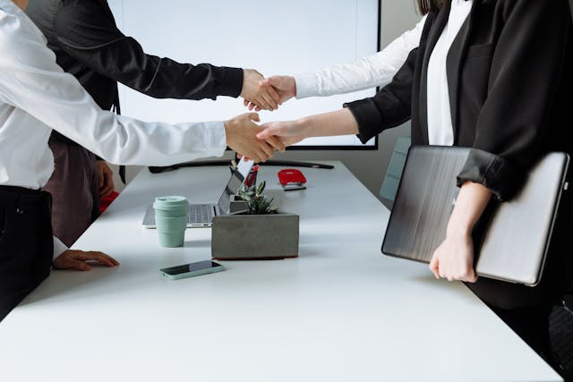 a group of people shaking hands